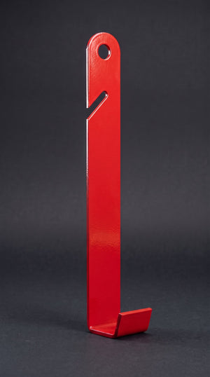 A single EZpanl siding hook: flat red powder-coated 11 gauge steel strap with a round nail hole at the top, a short angled slot on the left edge that opens downward, and a J-shaped foot the panel edge rests in